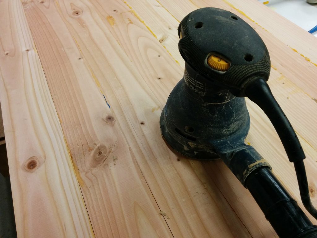 Started with a random orbital sander.