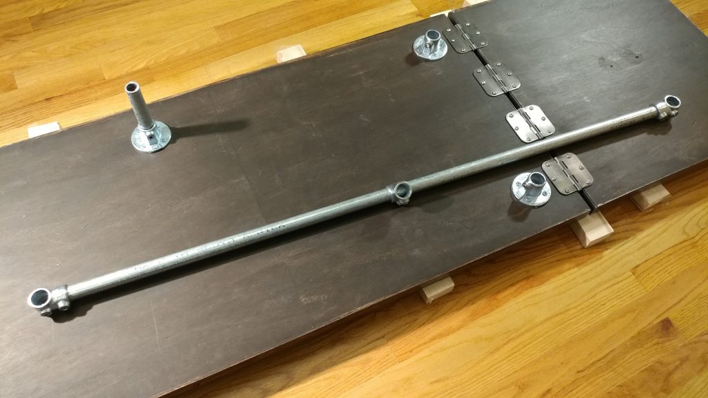 I then created the rear horizontal brace with the longest piece and three of the single socket tees, with the middle one fitting loosely on the bar.