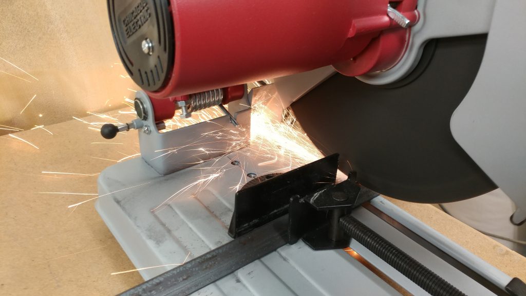 Cutting the angle iron on my chop saw.