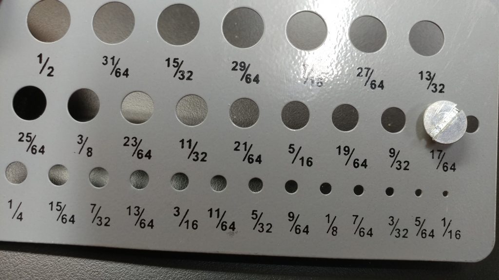 The bolts require a 17/64 hole for clearance through the angle iron.