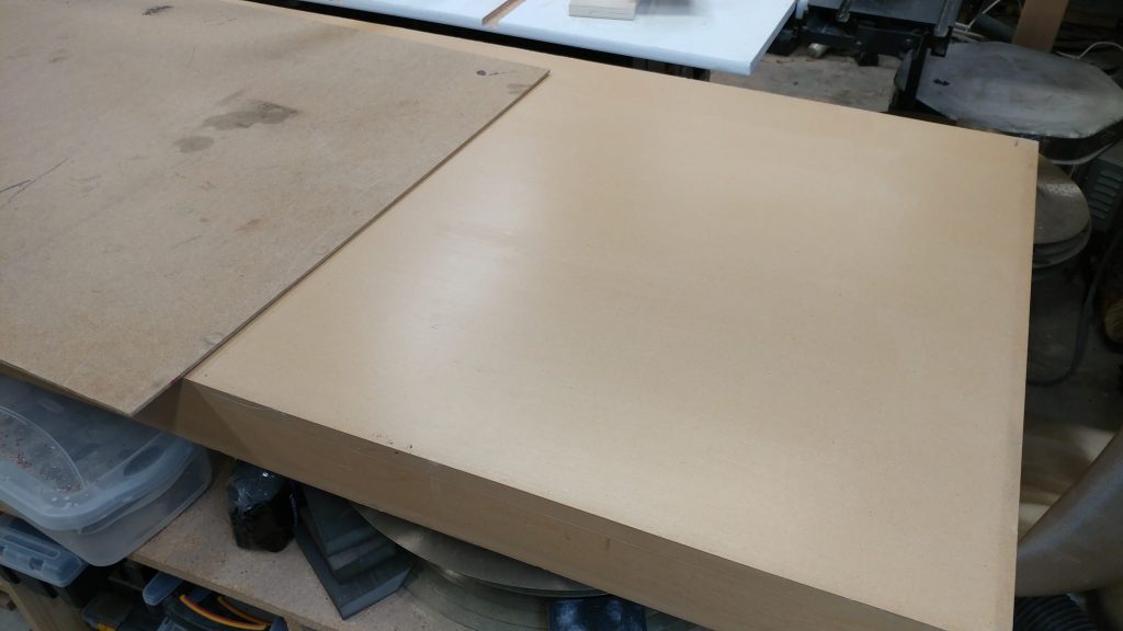 My work surface is usually a sheet of 1/8" hardboard.